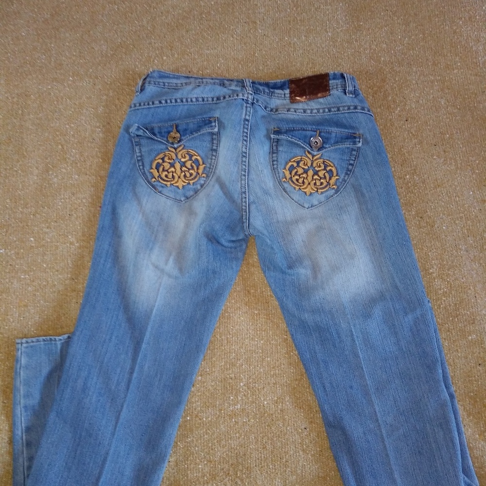 Apple bottoms ripped jeans. Golden apple design